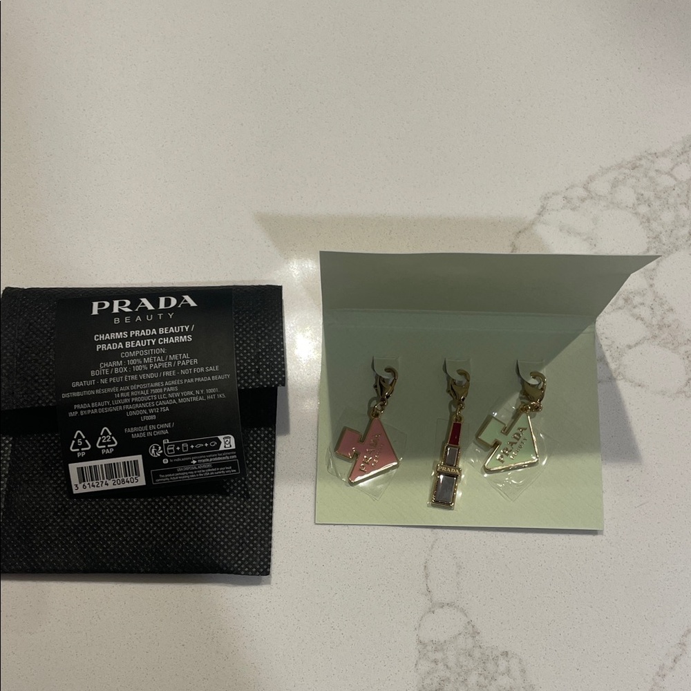 Prada Beauty Charms in Pink, Red, and Cream